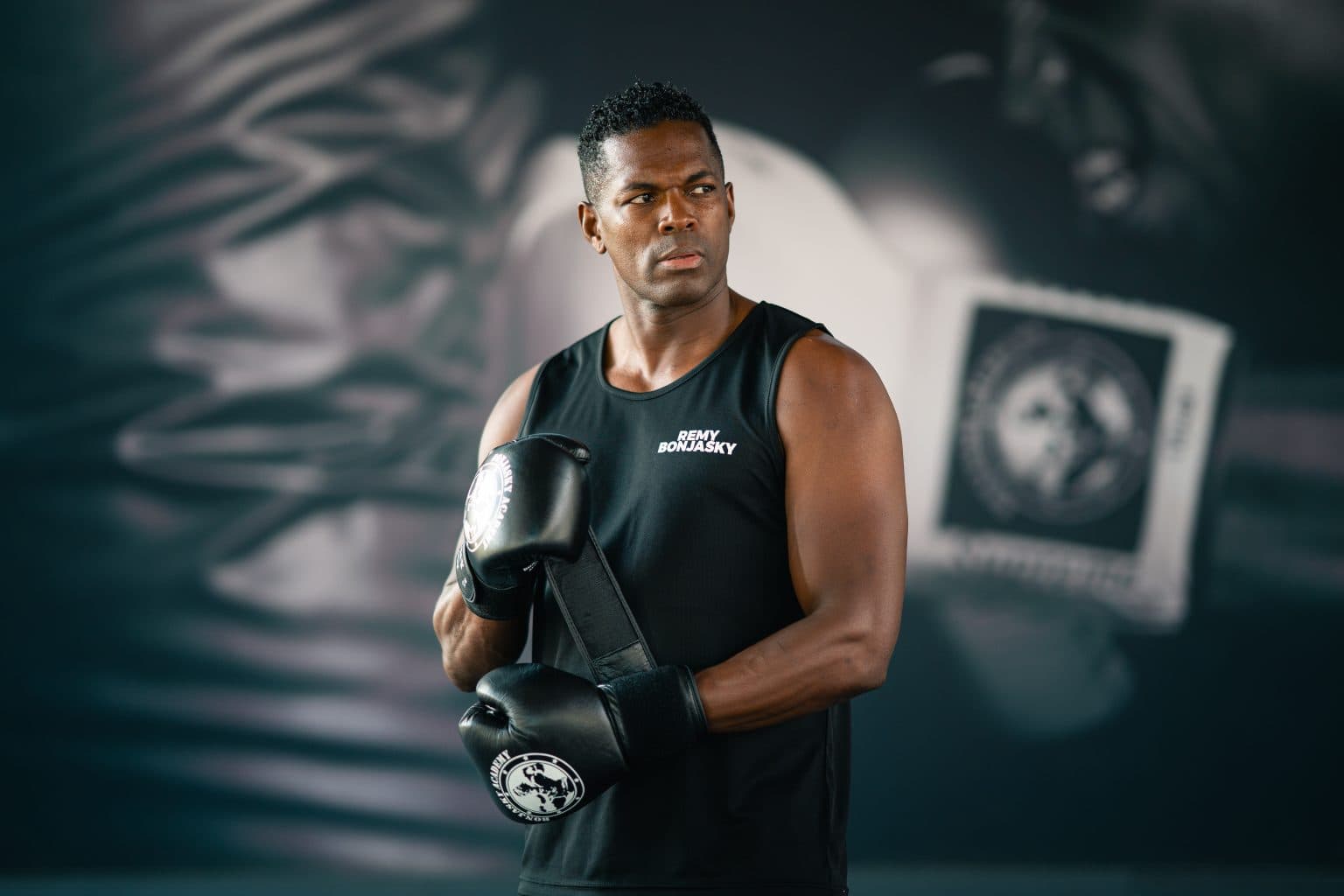 Remy Bonjasky with boxing gloves draped over his arm at the Bonjasky Academy.